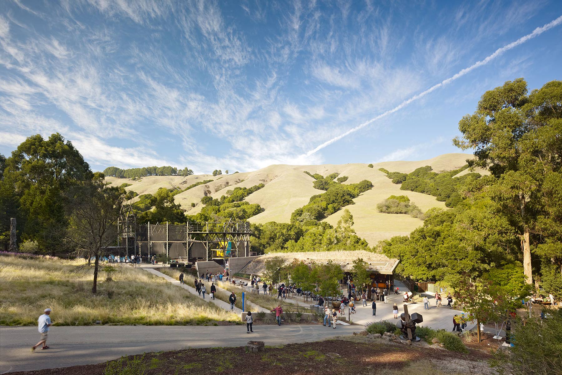 The Sharon Simpson Center at the California Shakespeare Theater, located in the San Francisco Bay Area, encourages environmental stewardship and sustainable goals by utilizing a living roof and being integrated into the natural landscape of the site.