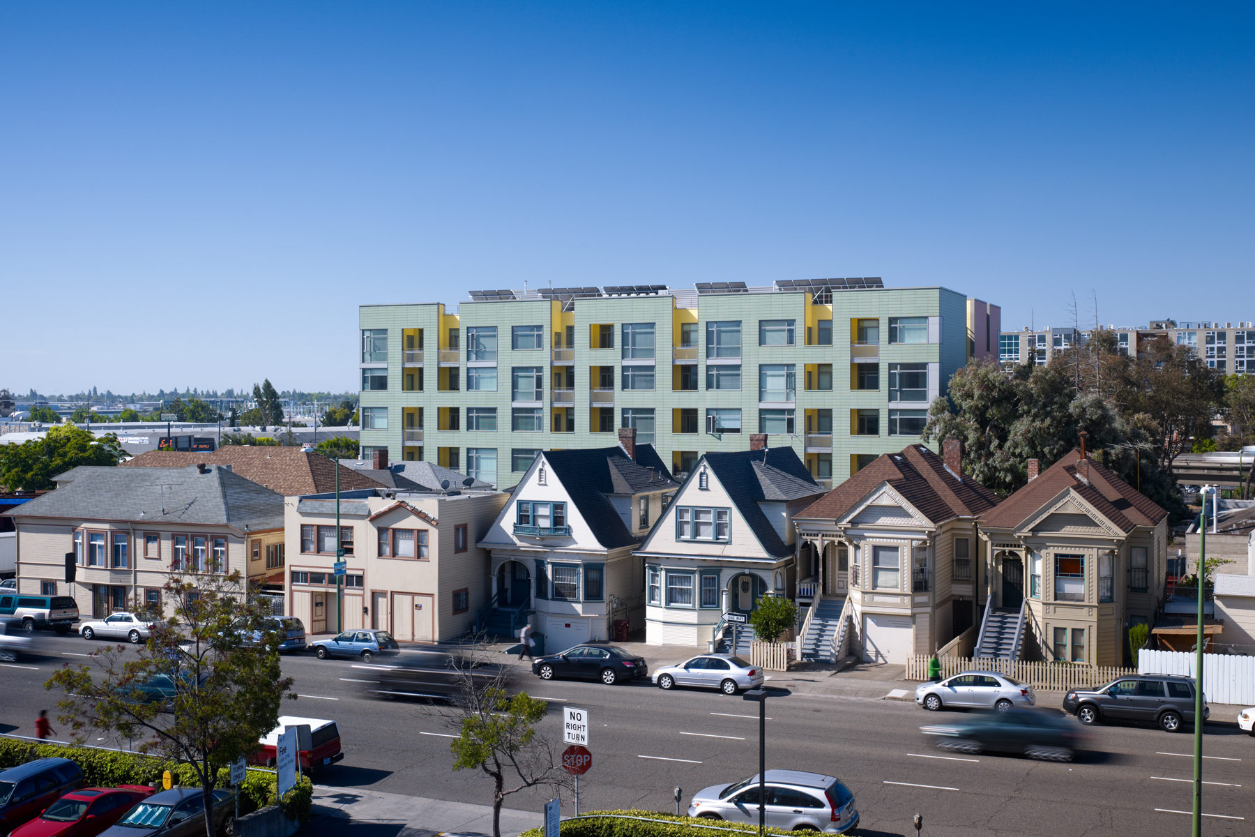 Merritt Crossing is a Green Point rated and LEED Platinum certified affordable housing building for seniors, a model of sustainable design in an urban area of Oakland in the Bay Area.